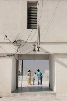 Family on the roof in Ahmedabad, relaxed atmosphere and harmonious togetherness.