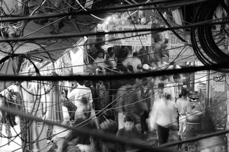 Wall art by Jagdev Singh: bustling market scene in Old Delhi