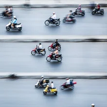 Photo art by Jörg Faißt: Moped riders on a busy street in Hanoi.