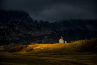 Photo art by Dejan Dajkovic: church on a hill at sunrise in Montenegro.