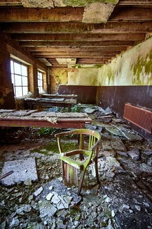 Photo art by Sascha Faber: abandoned office chair in a burnt-out setting