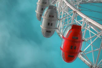 Photo art by Michael Belhadi: London Eye at night with soft lights and reflecting water.