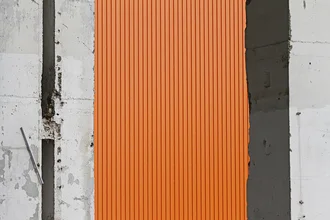 Photo art by Michael Belhadi: Ruined building in Lichtenberg with orange globe