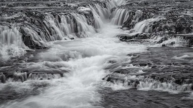 Long exposure of Bruararfoss waterfall in Iceland with gentle water streams.