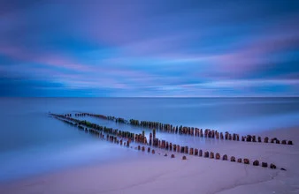 Photo art by Anne Beringmeier: clouds over a North Sea island with beach and stage