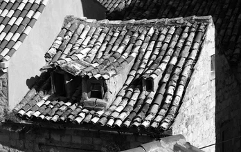 Photo art by Holger Ostwald: Weathered roof in Dubrovnik with wooden windows