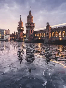 Berlin's Oberbaum Bridge in winter, soft colors and a calm atmosphere.