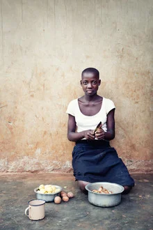 Photo art by Victoria Knobloch: A girl cooking in a Ugandan village.