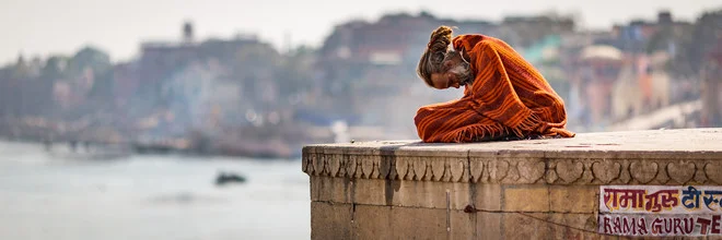 Photo art by Sebastian Rost: serene view of a Sadhu by the Ganges riverbank