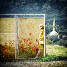 Photo art by Ambra A: a woman surrounded by poppies with a mosque in the background