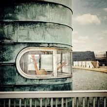 Photo art by Ambra A: Woman at a window with a view of the Copenhagen tower.