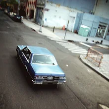 Photo art by Kay Block: mysterious street scene with a fleeing car in New York City