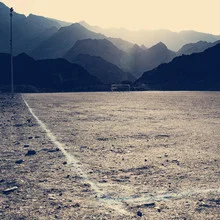 Photo art by Franz Sussbauer: scene with football and mountains in Oman