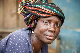 Photo art featuring a portrait of a woman from Serabu, gazing into the camera.