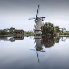 Photo art by Ronny Behnert: serene scene with windmills in Kinderdijk