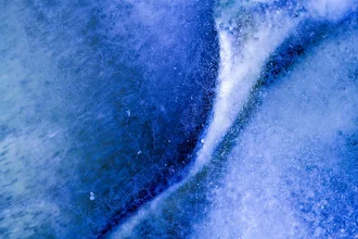 Close-up of a frozen ice surface with delicate crystals