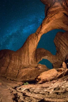 Photo art by Christoph Schaarschmidt: triple arch under the night sky in Utah
