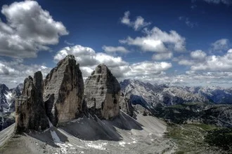 Photo art by Björn Groß: the majestic Tre Cime de Lavaredo in the Italian Alps landscape.