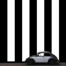 Photo art by Pascal Krumm: a Volkswagen Beetle on crosswalk stripes in Chile