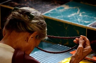 Photo art by Michael Stoll: serene capture of a monk at sunrise in Myanmar