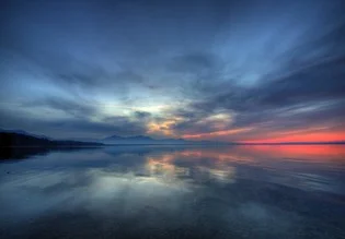 Photo art by Björn Groß: calm landscape at Chiemsee with gentle waves.