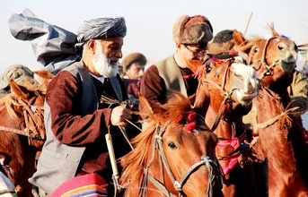 Photo art by Ruth Halle: Buzkashi race with horses in Afghanistan.
