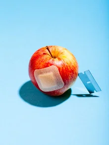 Photo art by Stéphane Dupin: minimalist still life featuring an apple and a razor blade.