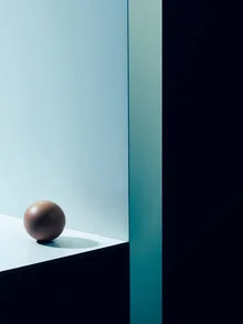 Minimalist photo art featuring an egg on a simple background