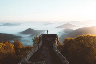 Photo art by Philipp Heigel: Wanderer in fog before a castle in the Palatinate