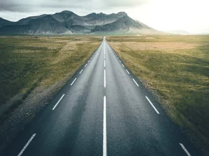 Photo art by Patrick Monatsberger: aerial view of a winding road in Iceland