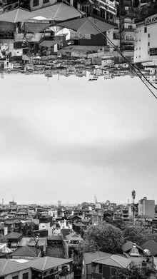 Photo art by Arno Kohlem: Upside-down houses in Hanoi at sundown