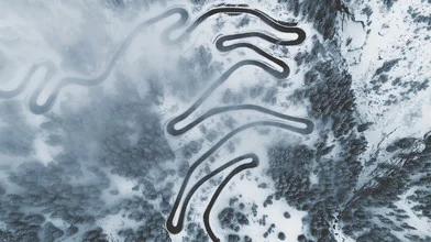 Wall art showing gentle curves of an alpine pass in a snowy winter landscape