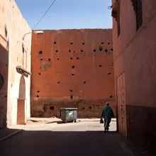Photo art by Nils Merkel: Man walking down a street in Marrakesh at sunset