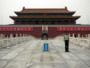 Soldier at the entrance of the Forbidden City in Beijing, soft colors and tranquil atmosphere.