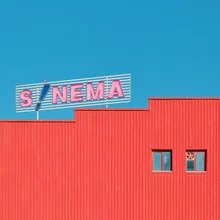 Photo art by Yener Torun: vibrant architectural shot featuring red and blue elements.