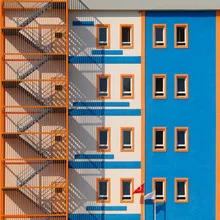 Colorful house facade with cheerful windows in an urban setting