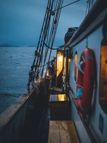 Cozy mood on a fishing boat during blue hour