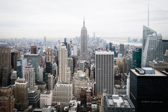 Aerial view of Manhattan showcasing the urban skyline with the Empire State Building.