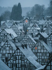 Photo art by André Alexander: winter landscape with snow-covered half-timbered houses