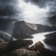 Photo art by Frithjof Hamacher: sun rays over a calm lake in nature.