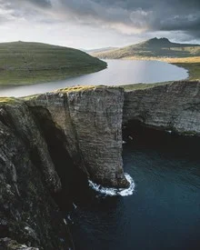 Photo art by Jan Keller: serene landscape featuring Sorvagsvatn Lake above the Atlantic Ocean
