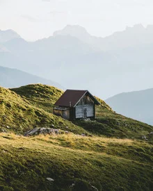 Photo art by Jan Keller: Cozy cabin in the Alps with mountain view.