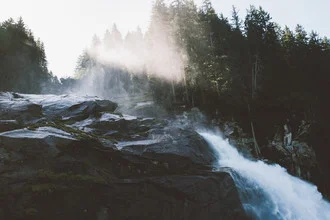 Photo art by Quentin Strohmeier: gentle light reflections over a waterfall