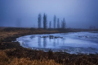Photo art by Philip Gunkel: misty lake with frozen shores in a calm landscape