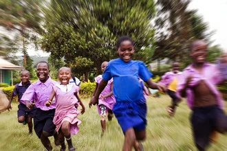 Photo art by Victoria Knobloch: joyful children playing in Uganda.
