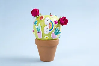 Photo art by Loulou von Glup: a quirky apple cactus in a flower pot