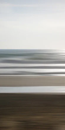 Photo art by Steffi Louis: gentle Atlantic waves under a clear sky