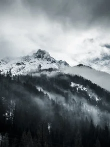 Photo art by Sascha Forkapic: dramatic view of snow-covered mountains in Austria.