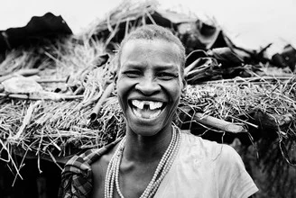 Photo art by Victoria Knobloch: smiling Ugandan woman in traditional attire