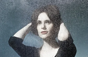 Photo art by Victoria Knobloch: woman with drops on her face, reflective mood.